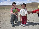 Tibet Kailash 03 Nyalam to Peiku Tso 07 Shishapangma Checkpoint Peter and Dawa The same caretaker was at the Shishapangma Checkpoint as in 2005. We were pleased to again meet their son Dawa, who is now 2  years old.